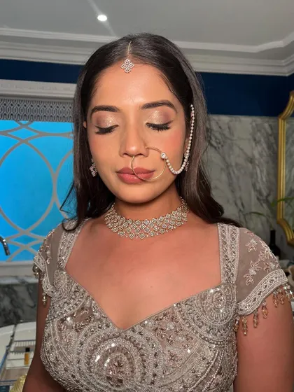 Another angle of this sparkling bridal glam. The focus is on luminous skin and eyes that catch the light beautifully.
