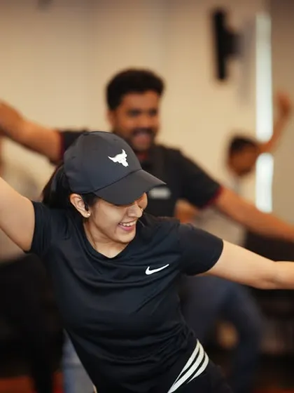 With arms up and big smiles, this team is fully immersed in the energy of the Zumba session. It's a perfect way to re-energize a team during a long conference or as a weekly wellness break.