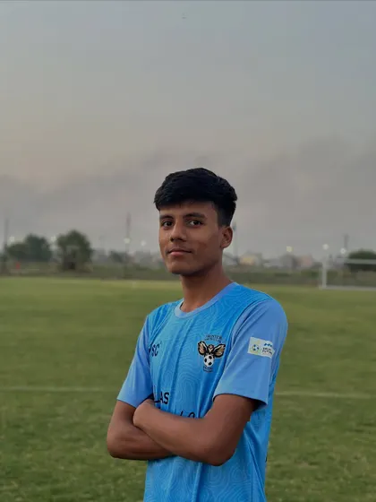 A player poses with a look of determination. This is the focus required to become a champion.