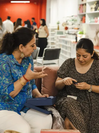 It's in these smaller, candid conversations that the real magic happens. Two entrepreneurs deep in discussion, sharing insights and experiences during a networking break.