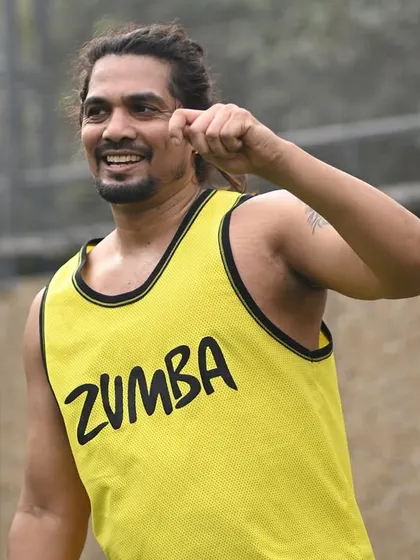 Another look at me leading the corporate Zumba event, bringing high energy and fun moves to the participants.