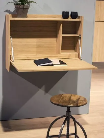 A smart, space-saving wall-mounted study table that folds away when not in use. This is a great example of my custom solutions for smaller spaces.