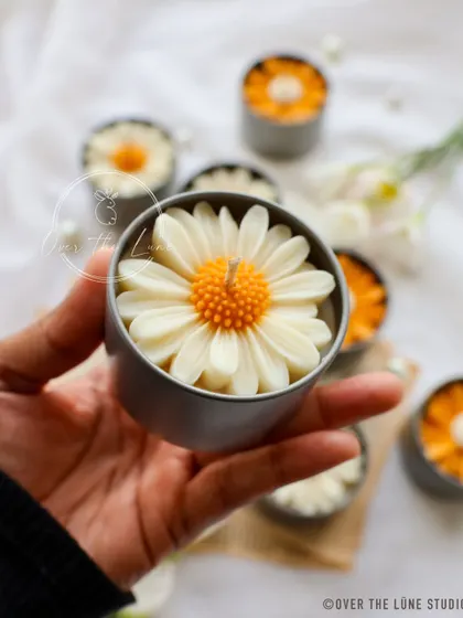 Holding one of my new Daisy Mini Candles. You can see how perfectly the detailed daisy flower fits inside the cute little tin.