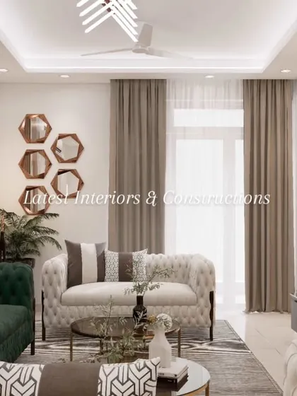 This perspective shows the interplay of textures, from the plush sofas and soft rug to the smooth marble and warm wood. The hexagonal mirror installation adds a touch of modern, geometric art to the wall.
