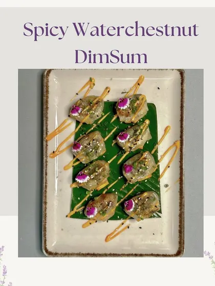 Our Spicy Waterchestnut Dim Sum, drizzled with a savory sauce and garnished with edible flowers. This dish offers a delightful crunch and a kick of spice.