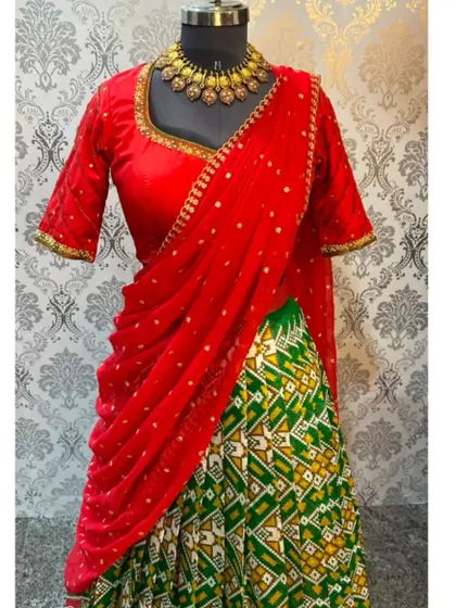 The full view of the rental Patola lehenga set, complete with a beautiful necklace to give you an idea of how to style it.