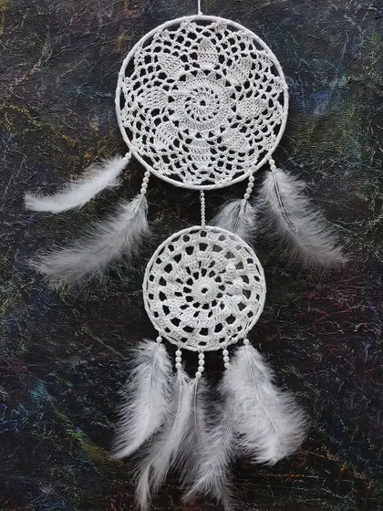 A delicate and beautiful white dreamcatcher made with crochet and feathers. Our craft classes explore a variety of popular and traditional crafting techniques.