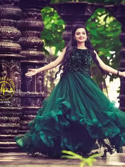 A solo shot of the bride-to-be, twirling in the gorgeous green gown. My makeup and hair styling ensured she felt confident and beautiful throughout her photoshoot.