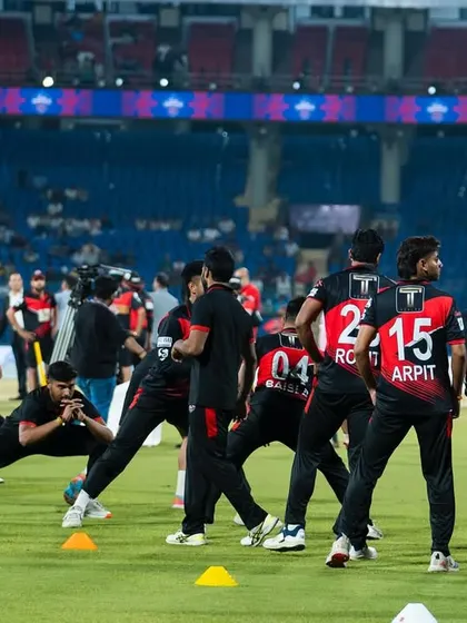 Leading the team through a dynamic warm-up under the stadium lights. This is where we set the tone for the match ahead.
