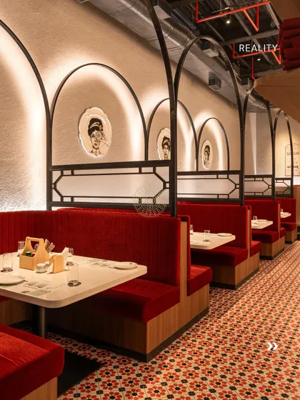 The reality of the booth seating. Every detail, from the lighting within the arches to the upholstery, was executed just as planned to bring our vision to life.