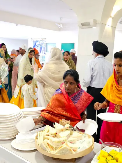 Another view of the baraat breakfast, showing the organized and clean setup with stacks of plates ready for the guests.