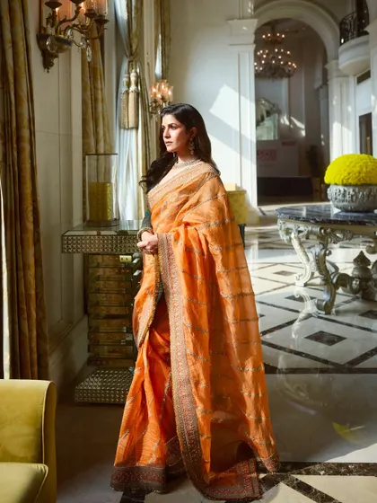 Here is the full look for Nimrat Kaur, set in a beautiful, sunlit room. The makeup is balanced to work with natural light, creating an ethereal glow that feels both effortless and glamorous.
