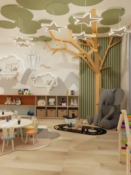 This crèche interior blends vibrant colors, soft textures, and playful elements. The space includes interactive play zones, a tree-shaped bookshelf, and star-shaped lighting to spark joy and ensure safety.