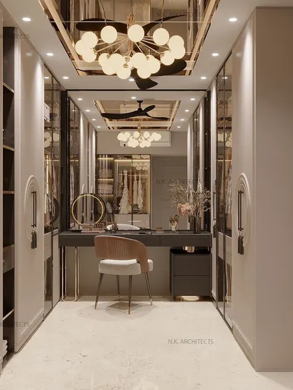 A beautiful place to sit and get ready sets a positive tone for the day. This walk-in closet features a sleek vanity, mirrored wardrobes, and a stunning modern chandelier.