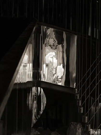 A collection of atmospheric shots from Lair, showcasing the interplay of black concrete, glass blocks, polished steel, and dramatic lighting. Each image captures a fragment of the bar's mysterious and immersive character.