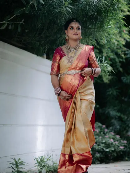 Client Deepa looking elegant for her brother's wedding. She chose a stunning Victorian-inspired layered haram set that beautifully complements her dual-tone silk saree.