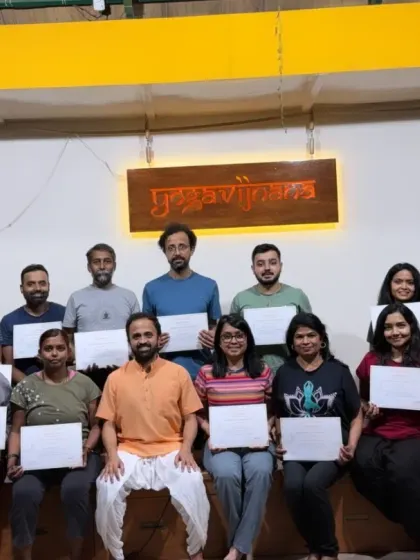 A group photo of the happy participants from our Yoga Kurunta workshop, holding their certificates. These specialized workshops are a great way to dive deeper into specific aspects of the yoga practice.