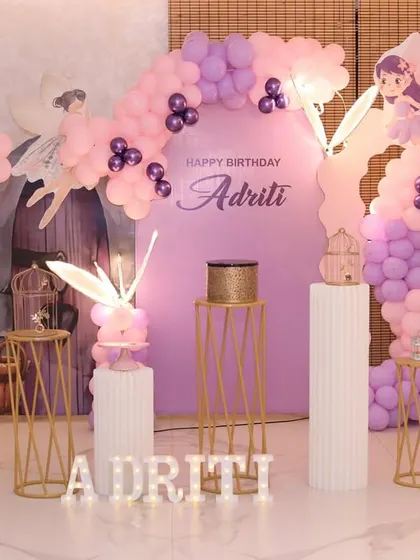 A delicate and airy butterfly theme in shades of pink and purple, with whimsical fairy cutouts.