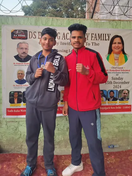 One of our boxers with his medal at the 1st DS Boxing League in Najafgarh. We encourage our students to participate in various open amateur tournaments.
