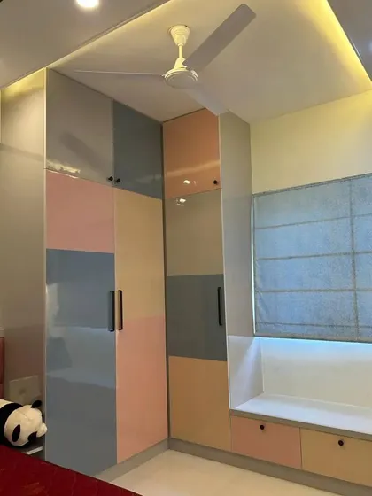 Why stick to one color? This multicolor wardrobe uses a playful combination of pastel pink, blue, and beige, creating a vibrant and youthful look perfect for a kid's room or a bold modern bedroom.