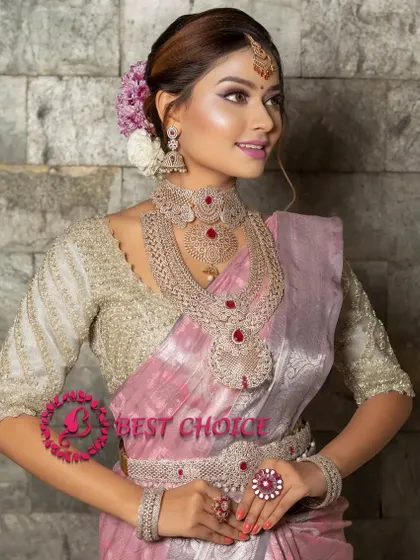 A model wearing our ruby and American Diamond layered set. The combination of a choker and a long necklace creates a stunning, modern bridal look.