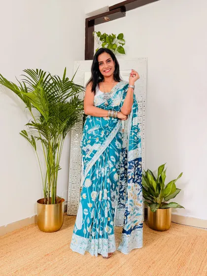 A lovely teal blue cotton mulmul saree with a delicate floral print. This is another affordable find from Meesho that is perfect for daily wear. It's lightweight and easy to manage.