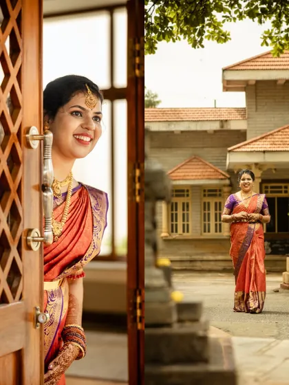 A creative shot of the bride peeking through the door during her Nischithartha, adding a touch of storytelling.
