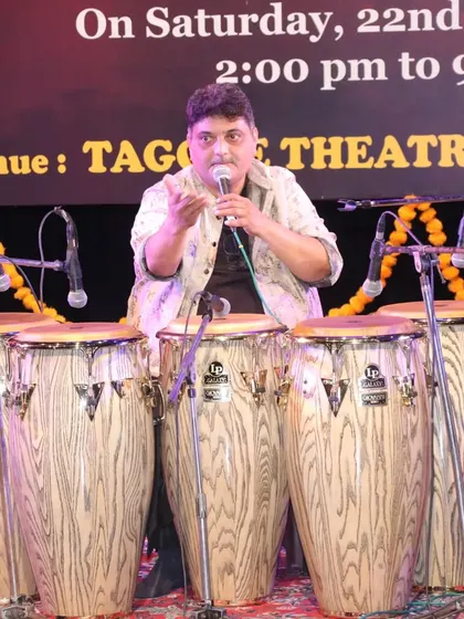 The great Nitin Shankar ji leading his percussion ensemble at the Ustad Alla Rakha Sangeet Sammelan. I am on the left, playing tabla as part of this powerful rhythmic story.