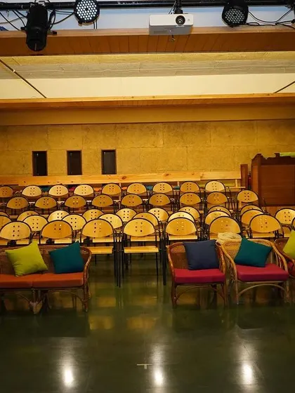 Our indoor theatre, set up and ready for a performance. The tiered seating and professional lighting ensure a great view and an intimate experience for every audience member.