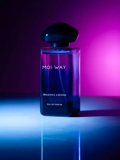 Using colored gels to light this perfume bottle with a vibrant pink and blue gradient. This technique creates a futuristic, neon-noir mood that is modern and eye-catching.