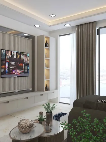 For this compact living room, I designed a floating TV unit with vertical fluting and integrated shelving. This approach maximizes floor space while providing ample storage and a sleek, modern look.