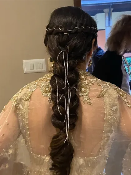 A side view of the diamond-studded braid, showing how the accessories catch the light.