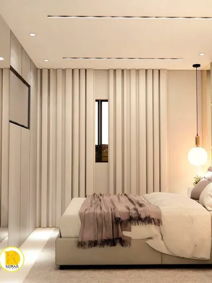 A view of the bedroom showing the full-wall mirrored wardrobe.