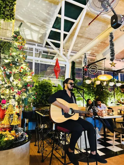 A wider view of the Christmas gig setup. Even as a solo performer, I can fill a large space with music and create a festive ambiance.
