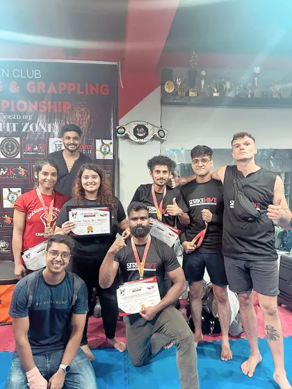 The winning team. Our students and coaches celebrate their success at the open kickboxing championship.