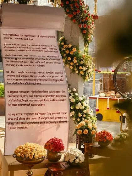 Another view of the wedding vow scroll, surrounded by beautiful floral arrangements.