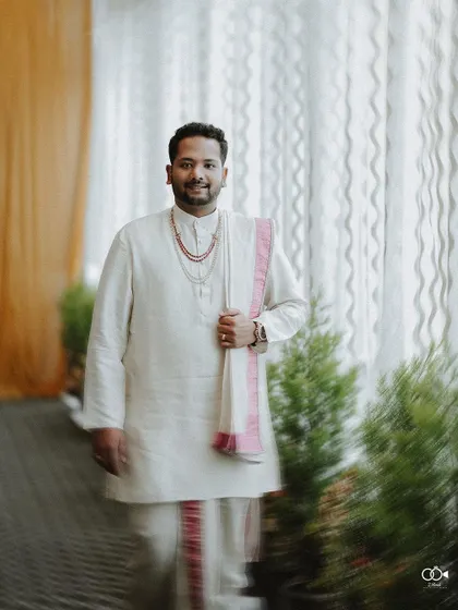 A duplicate of the handsome groom's portrait with motion blur.