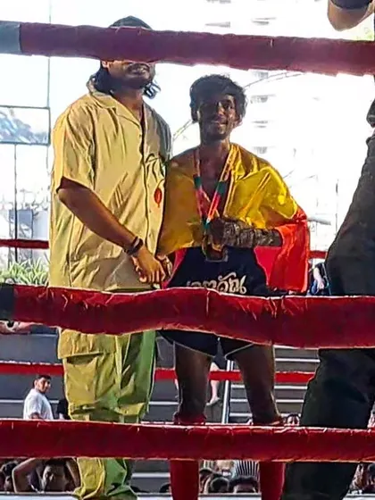 Another shot of our fighter celebrating with the Karnataka flag after a win in Kerala.