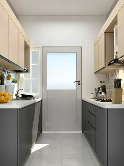 This parallel kitchen uses light-colored upper cabinets and a lighter floor to make the space feel wider. The layout provides two full counters for prep and cooking, proving that a small kitchen can still be highly functional.