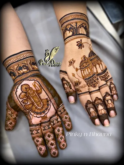 A pair of hands adorned with Karwa Chauth mehndi. One hand features a portrait of Shreenath Ji, while the other has a design of lanterns, creating a beautiful blend of devotion and festive light.
