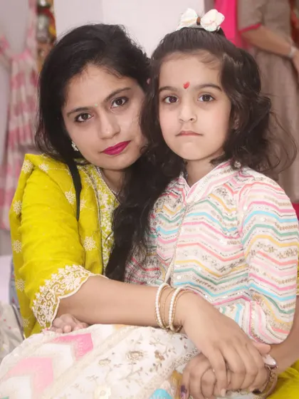 A mother and daughter share a loving embrace for a beautiful portrait.