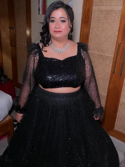 A beautiful client ready for a cocktail party in a black sequin lehenga. I created a soft glam look with a hint of shimmer on the eyes.