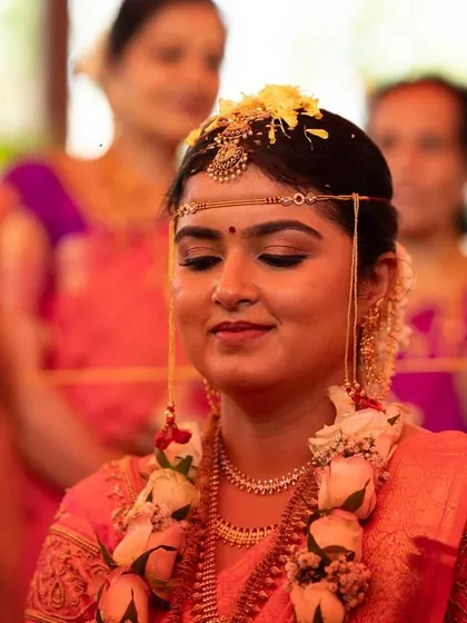 A candid moment during the wedding ceremony. The makeup is subtle enough to look natural even in close up, unposed shots.