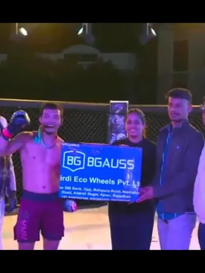 Our fighter receiving a cash prize for his victory at Elite Combat MMA, a reward for his outstanding performance.