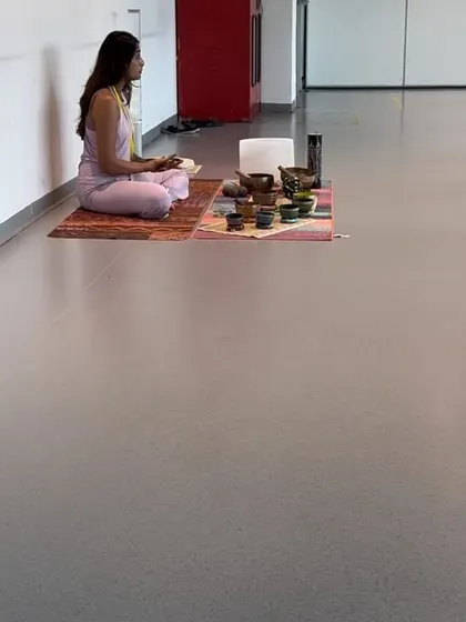A private client sits in meditation, surrounded by the healing instruments. The simplicity and quiet of a one-on-one session allows for profound personal insights and release.