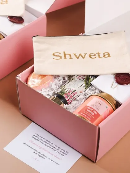 A "Will you be my bridesmaid?" hamper in a lovely shade of pink. This one features a personalized pouch with her name, making it extra special.