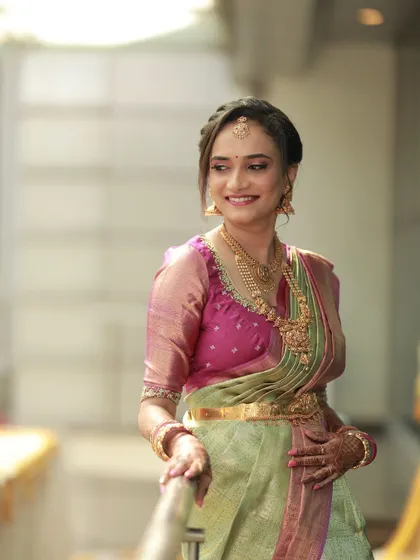 The perfect look for an engagement ceremony. I created a soft, romantic makeup look with a focus on radiant skin and a pretty pink lip to complement her lovely green and pink silk saree. Her happiness truly completes the look.