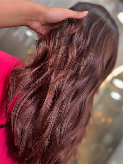 A close-up detail of the rich brown color, highlighting the subtle variations in tone that create a multi-dimensional effect.