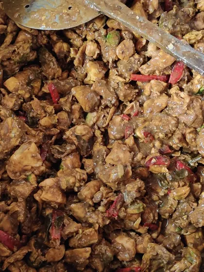 A large pot of our chicken curry, prepared with tender boneless pieces and a rich, spicy gravy. This is a crowd-pleasing dish that goes well with both rice and bread.
