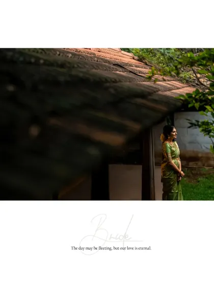 A thoughtful and artistic portrait of the bride, framed by the architecture of the building.